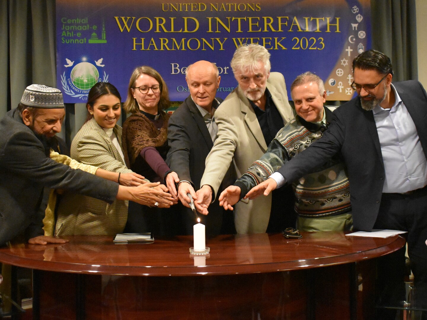 A candle for peace lit by muslim sikh hindu buddhist and christian representatives at WIHW program in Oslo on 9th febJPG